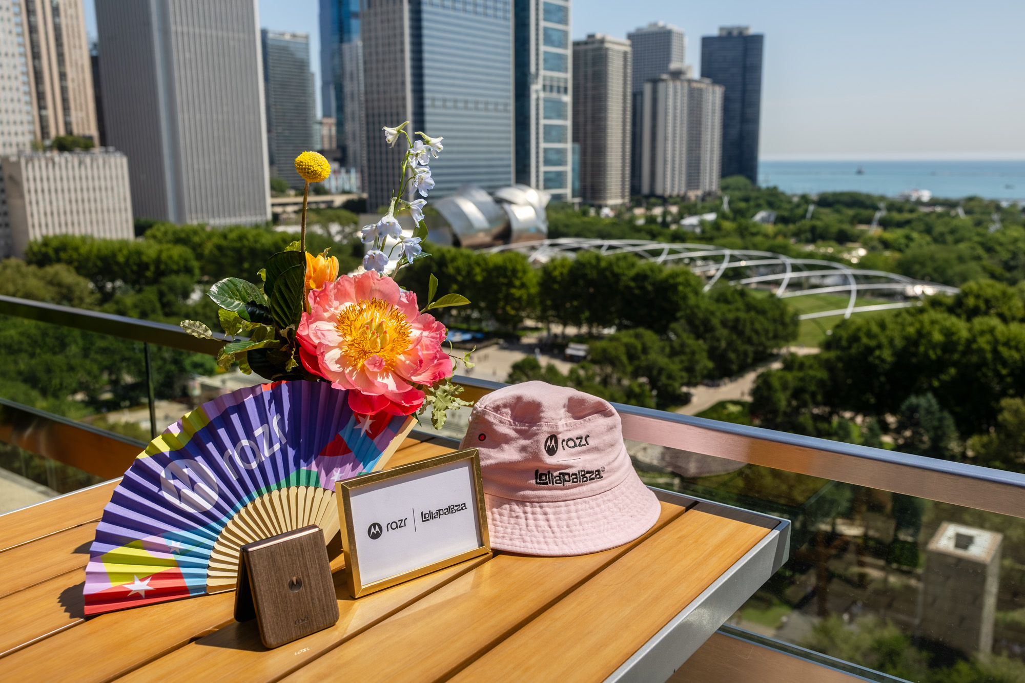 Rooftop gifting display with Motorola razr and Lollapalooza branded items overlooking Millennium Park at the Swarovski® activation
