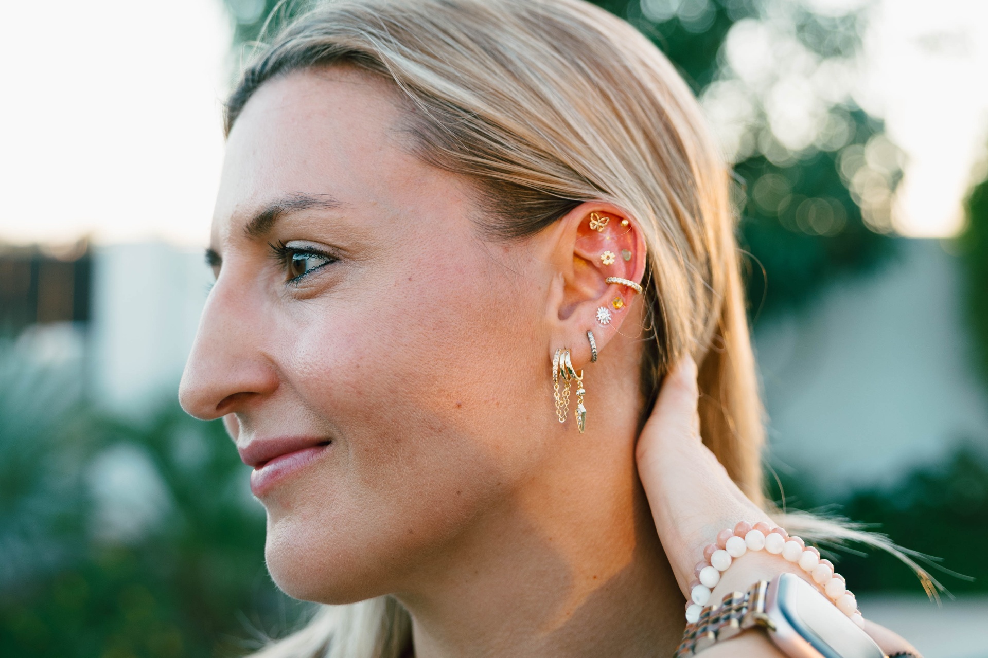 Curated ear stack featuring Swarovski crystals and gold details
