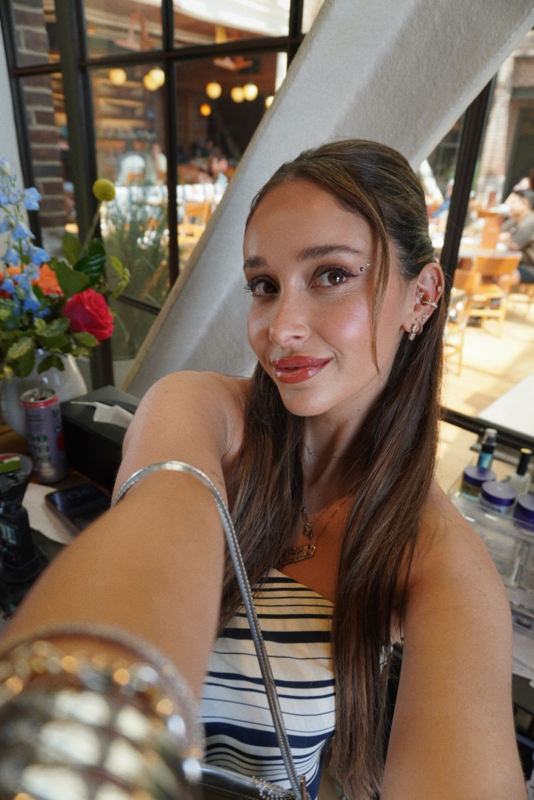 Guest showing off her curated ear stack at a Revel Road activation