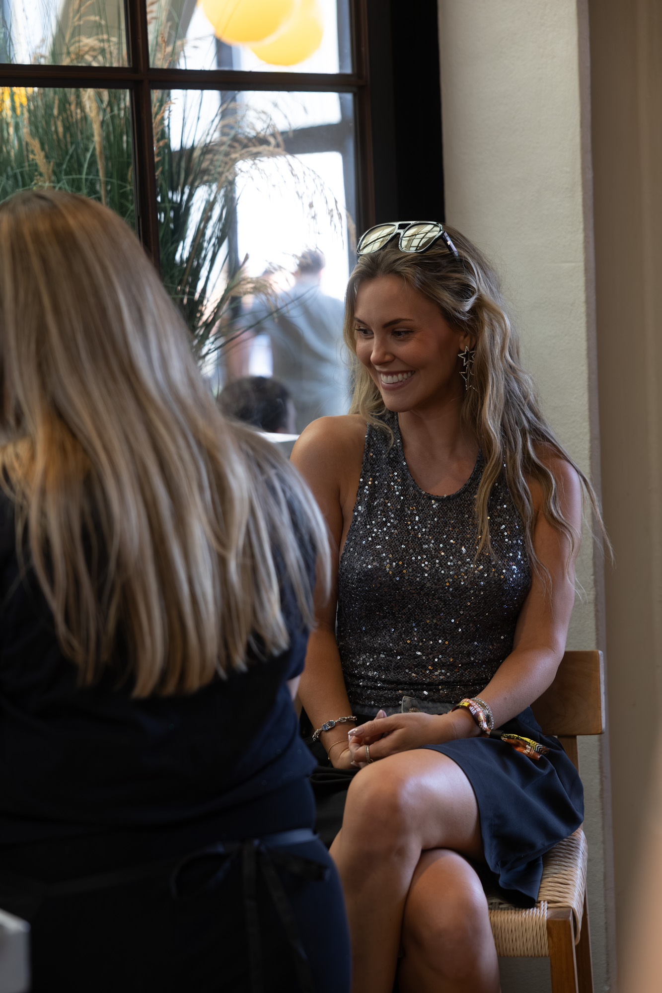 Guest laughing during her styling session at a Revel Road event